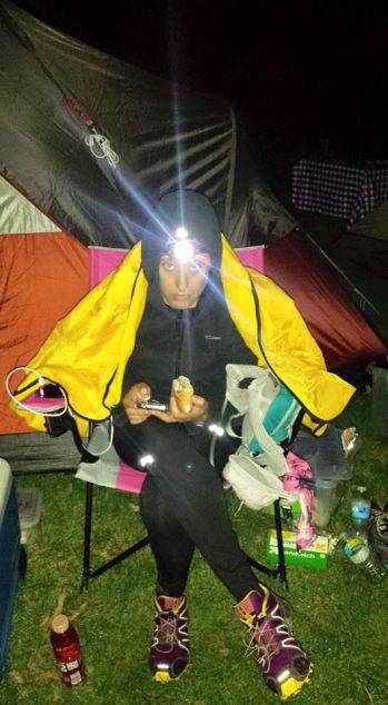 Overnight was NOT treating me well. Here I am trying to eat after Mile 60.